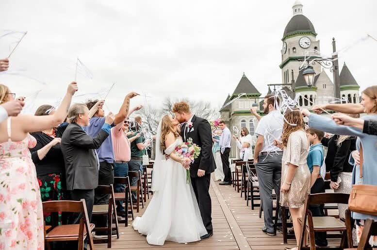 Wedding ceremony vows in the indoor brick-walled ceremony space