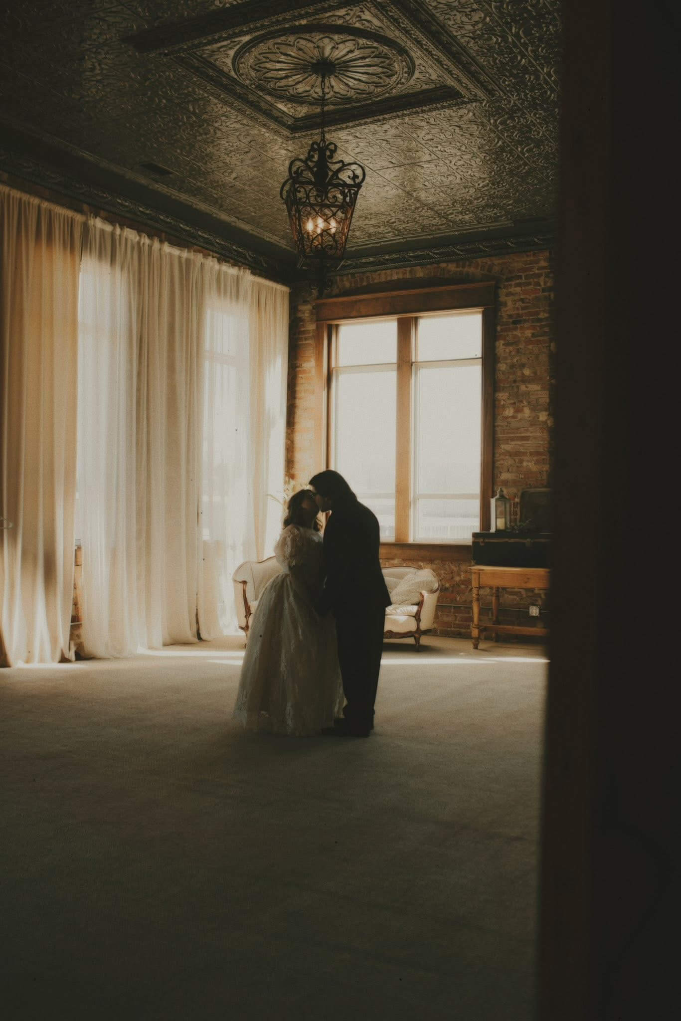 Marriage proposal at a candlelit fireplace inside The Gaderian